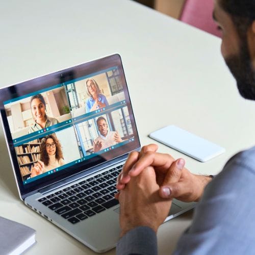 a man using video conference as a communication tool